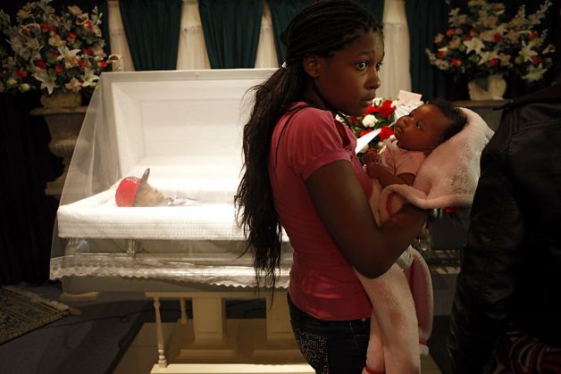 Tajjeunna Price, sister of Lamont DeShawn Price, 17, holds his 5-week-old daughter, KaMaya, during the family viewing of his body at Whitted-Atkins Funeral Home in Oakland on Feb. 28, 2012.
Photo: Lacy Atkins, The Chronicle
Read more: http://www.sfgate.com/crime/article/Saying-goodbye-to-slain-teen-in-Oakland-4342889.php#ixzz2QHGndZyZ
