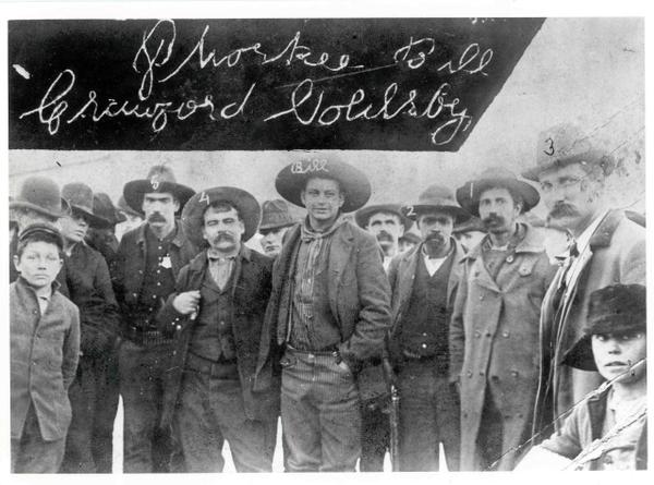 Cherokee Bill [above center with left hand in his pocket], who killed for the pleasure of killing, and his captors, on his arrival in Fort Smith, Arkansas, to face the Hanging Judge. Readig left to right: Zeke Crittenden and Dick Crittenden, deputy marshals; Bill; Clint Scales; Ike Rogers and deputy marshal Bill Smith. Source: http://www.jcs-group.com/oldwest/outlaws/cherokee.html